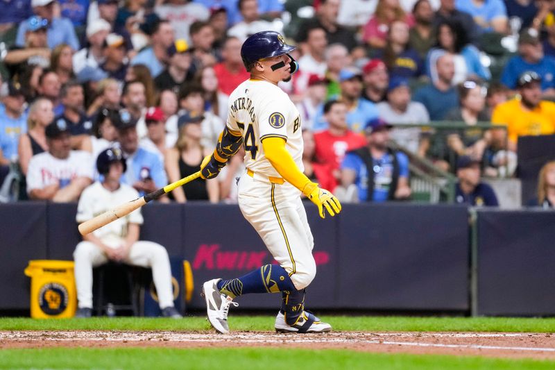 Sep 17, 2024; Milwaukee, Wisconsin, USA;  Milwaukee Brewers catcher William Contreras (24) singles during the fourth inning against the Philadelphia Phillies at American Family Field. Mandatory Credit: Jeff Hanisch-Imagn Images