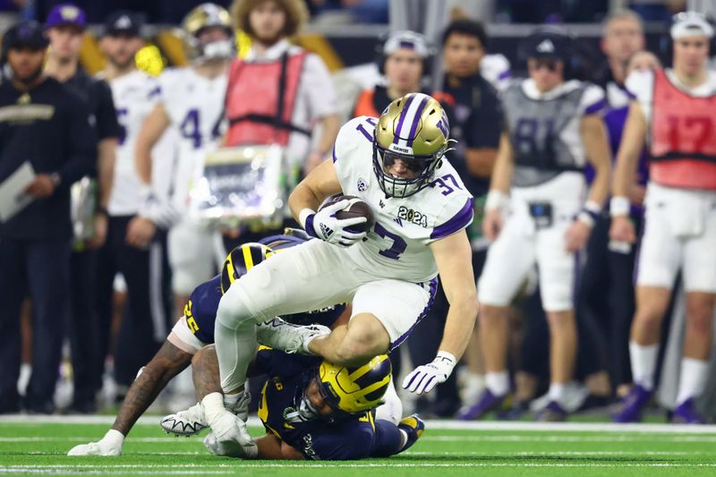 Jan 8, 2024; Houston, TX, USA; Washington Huskies tight end Jack Westover (37) runs with the ball against the Michigan Wolverines during the second quarter in the 2024 College Football Playoff national championship game at NRG Stadium. Mandatory Credit: Mark J. Rebilas-USA TODAY Sports