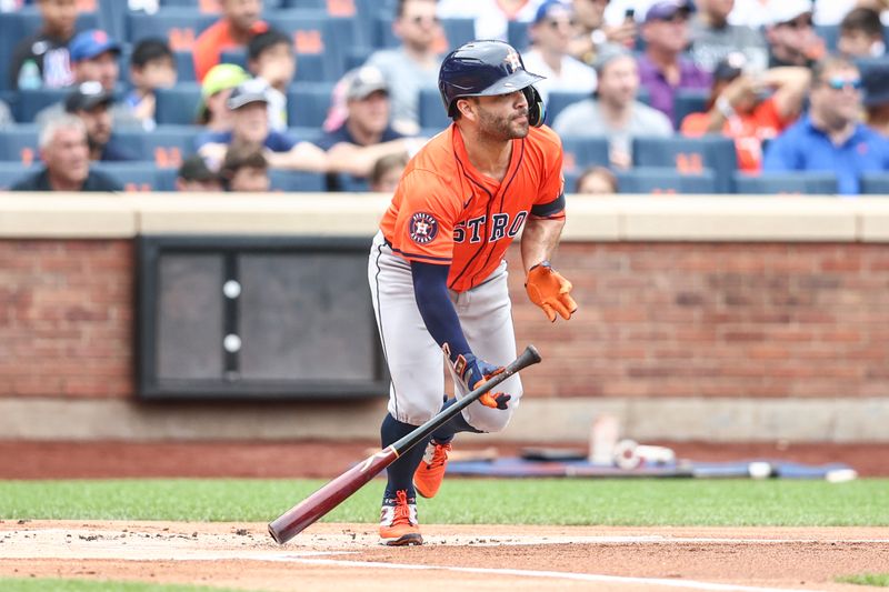 Jun 30, 2024; New York City, New York, USA;  Houston Astros second baseman Jose Altuve (27) hits a single in the first inning against the New York Mets at Citi Field. Mandatory Credit: Wendell Cruz-USA TODAY Sports