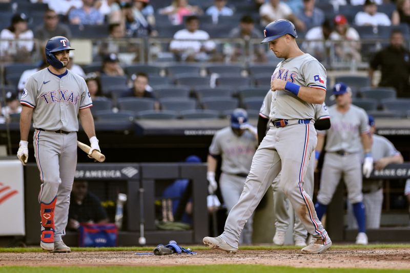 Aug 10, 2024; Bronx, New York, USA; Texas Rangers first baseman Nathaniel Lowe (30) scores on a bases loaded walk by New York Yankees pitcher Luke Weaver (not pictured) during the sixth inning at Yankee Stadium. Mandatory Credit: John Jones-USA TODAY Sports