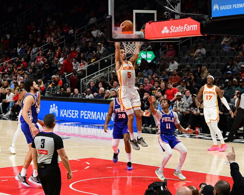 ATLANTA, GA - MARCH 10: Dyson Daniels #5 of the Atlanta Hawks dunks the ball during the game against the Philadelphia 76ers on March 10, 2025 at State Farm Arena in Atlanta, Georgia.  NOTE TO USER: User expressly acknowledges and agrees that, by downloading and/or using this Photograph, user is consenting to the terms and conditions of the Getty Images License Agreement. Mandatory Copyright Notice: Copyright 2025 NBAE(Photo by Adam Hagy/NBAE via Getty Images)