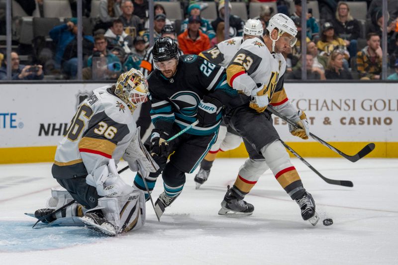 Feb 19, 2024; San Jose, California, USA; Vegas Golden Knights defenseman Alec Martinez (23) makes a save with his skate in front of San Jose Sharks center Ryan Carpenter (22) during the second period at SAP Center at San Jose. Mandatory Credit: Neville E. Guard-USA TODAY Sports