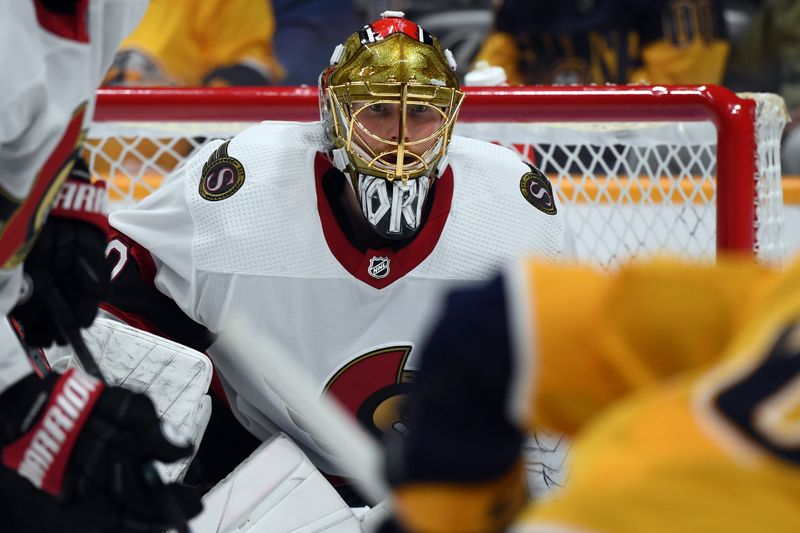 Feb 27, 2024; Nashville, Tennessee, USA; Ottawa Senators goaltender Joonas Korpisalo (70) watches the puck on a face off during the third period against the Nashville Predators at Bridgestone Arena. Mandatory Credit: Christopher Hanewinckel-USA TODAY Sports