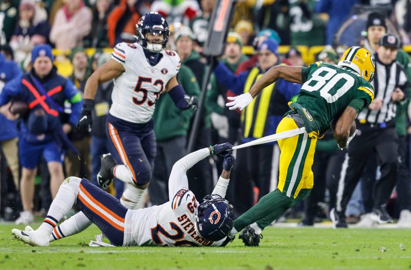 Green Bay Packers wide receiver Bo Melton (80) runs with the ball during an NFL football game against the Chicago Bears Sunday, Jan. 7, 2024, in Green Bay, Wis. (AP Photo/Jeffrey Phelps