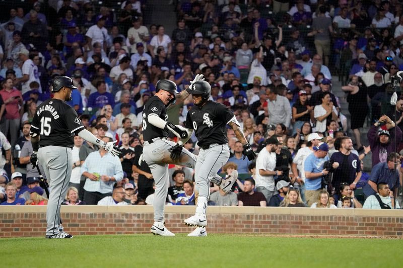 Jun 4, 2024; Chicago, Illinois, USA; Chicago White Sox third base Lenyn Sosa (50) celebrates his two-run home run against the Chicago Cubs with Chicago White Sox catcher Korey Lee (26) during the fourth inning at Wrigley Field. Mandatory Credit: David Banks-USA TODAY Sports