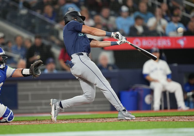 Apr 9, 2024; Toronto, Ontario, CAN; Seattle Mariners outfielder Dominic Canzone (8) hits a home run against the Toronto Blue Jays during the seventh inning at Rogers Centre. Mandatory Credit: Nick Turchiaro-USA TODAY Sports