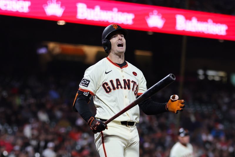 Aug 12, 2024; San Francisco, California, USA; San Francisco Giants outfielder Mike Yastrzemski (5) strikes out during the tenth inning against the Atlanta Braves at Oracle Park. Mandatory Credit: Sergio Estrada-USA TODAY Sports