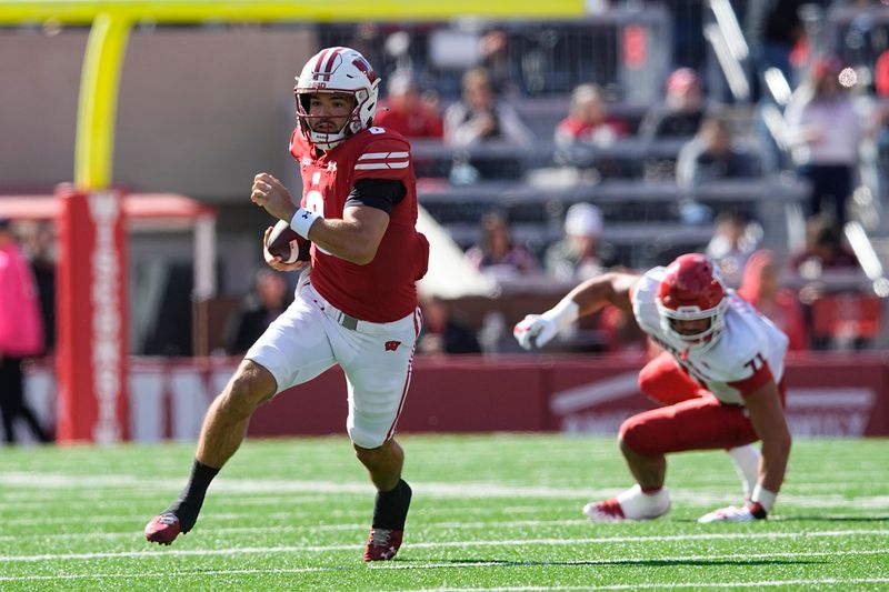 Oct 7, 2023; Madison, Wisconsin, USA;  Wisconsin Badgers quarterback Tanner Mordecai (8) rushes with the football during the first quarter against the Rutgers Scarlet Knights at Camp Randall Stadium. Mandatory Credit: Jeff Hanisch-USA TODAY Sports