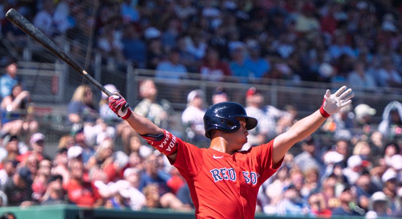 Mar 11, 2025; Fort Myers, Florida, USA; Boston Red Sox Masataka Yoshida (7) flies out to left field during their spring training game with the Phillies at JetBlue Park at Fenway South. Mandatory Credit: Chris Tilley-Imagn Images