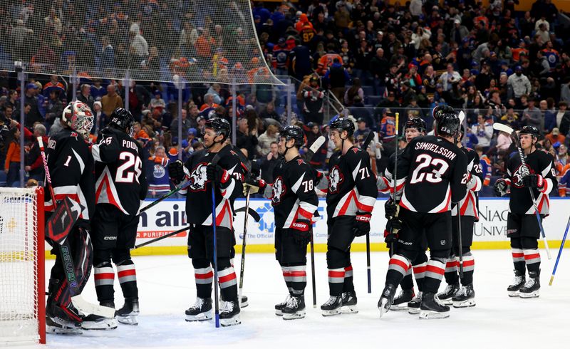 Mar 10, 2025; Buffalo, New York, USA;  The Buffalo Sabres celebrate a win over the Edmonton Oilers at KeyBank Center. Mandatory Credit: Timothy T. Ludwig-Imagn Images