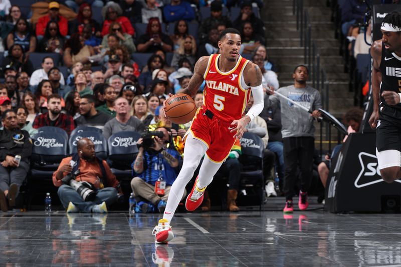 MEMPHIS, TN - MARCH 8: Dejounte Murray #5 of the Atlanta Hawks dribbles the ball during the game against the Memphis Grizzlies on March 8, 2024 at FedExForum in Memphis, Tennessee. NOTE TO USER: User expressly acknowledges and agrees that, by downloading and or using this photograph, User is consenting to the terms and conditions of the Getty Images License Agreement. Mandatory Copyright Notice: Copyright 2024 NBAE (Photo by Joe Murphy/NBAE via Getty Images)