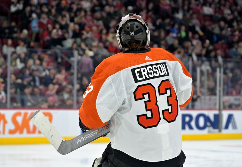 Apr 9, 2024; Montreal, Quebec, CAN; Philadelphia Flyers goalie Samuel Ersson (33) takes a breather during the second period of the game against the Montreal Canadiens at the Bell Centre. Mandatory Credit: Eric Bolte-USA TODAY Sports