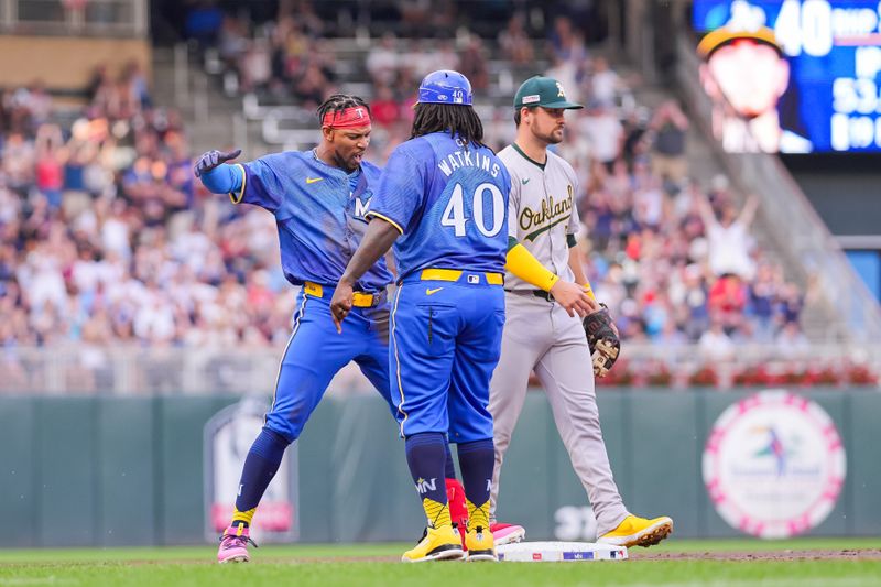 Jun 14, 2024; Minneapolis, Minnesota, USA; Minnesota Twins outfielder Byron Buxton (25) celebrates his triple against the Oakland Athletics in the second inning at Target Field. Mandatory Credit: Brad Rempel-USA TODAY Sports