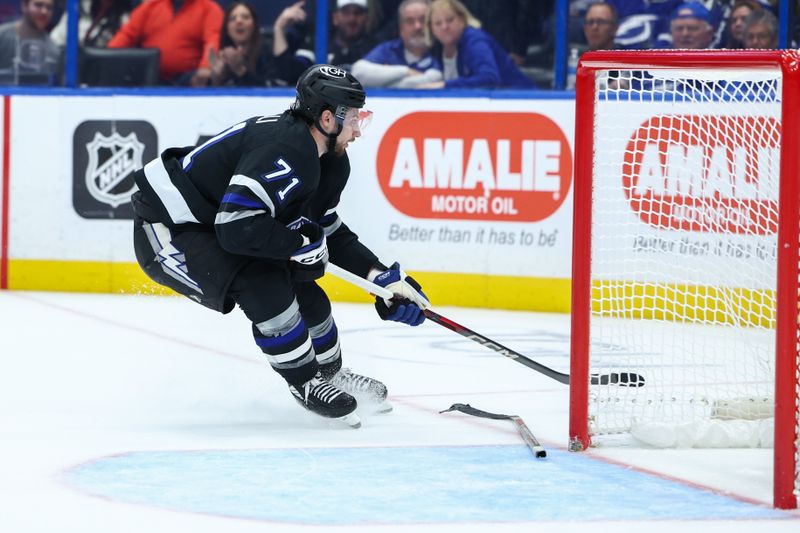 Nov 16, 2024; Tampa, Florida, USA; Tampa Bay Lightning center Anthony Cirelli (71)  blocked shot by a thrown stick  was ruled a goal against the New Jersey Devils in the third period at Amalie Arena. Mandatory Credit: Nathan Ray Seebeck-Imagn Images