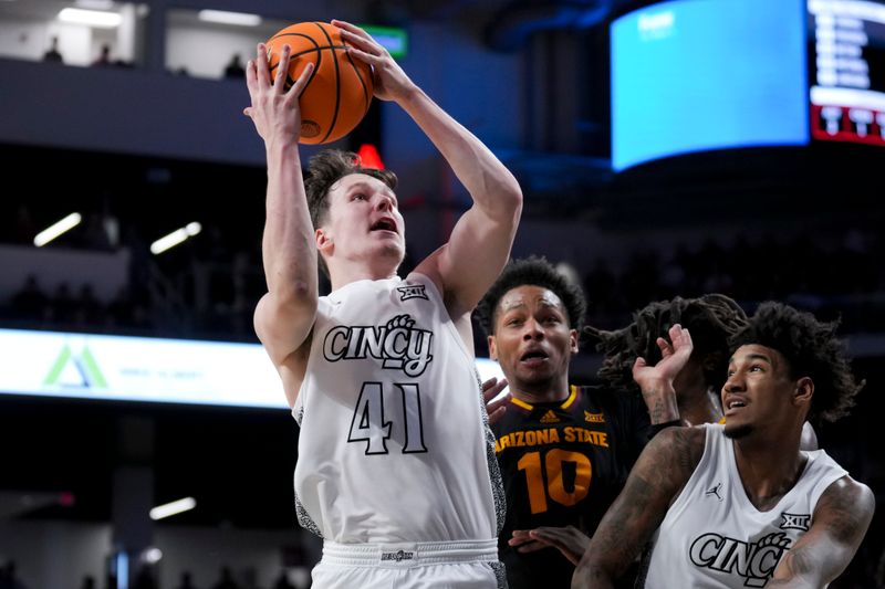 Jan 18, 2025; Cincinnati, Ohio, USA;  Cincinnati Bearcats guard Simas Lukosius (41) drives to the basket against the Arizona State Sun Devils in the first half at Fifth Third Arena. Mandatory Credit: Aaron Doster-Imagn Images