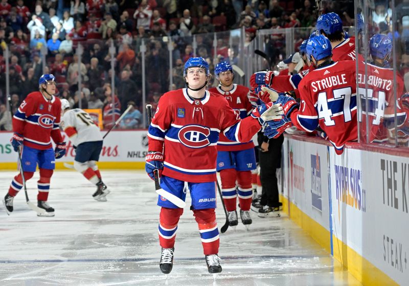 Apr 2, 2024; Montreal, Quebec, CAN; Montreal Canadiens forward Cole Caufield (22) celebrates with teammates after scoring a goal against the Florida Panthers during the third period at the Bell Centre. Mandatory Credit: Eric Bolte-USA TODAY Sports