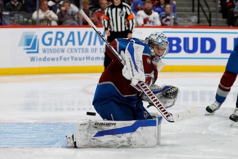 Nov 15, 2024; Denver, Colorado, USA; Colorado Avalanche goaltender Trent Miner (50) deflects a shot in the third period against the Washington Capitals at Ball Arena. Mandatory Credit: Isaiah J. Downing-Imagn Images