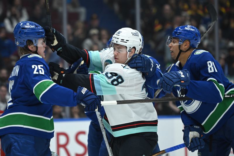 Apr 2, 2025; Vancouver, British Columbia, CAN;  Vancouver Canucks defenseman Elias Pettersson (25) fights Seattle Kraken forward Jani Nyma (38) during the third period at Rogers Arena. Mandatory Credit: Simon Fearn-Imagn Images