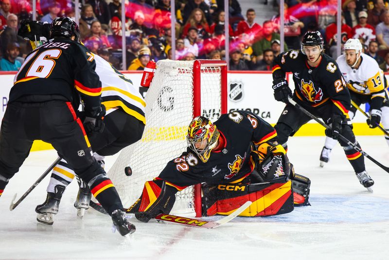 Oct 22, 2024; Calgary, Alberta, CAN; Calgary Flames goaltender Dustin Wolf (32) guards his net against the Pittsburgh Penguins during the first period at Scotiabank Saddledome. Mandatory Credit: Sergei Belski-Imagn Images