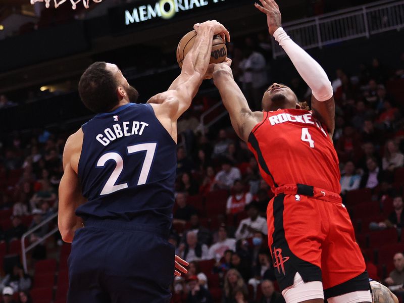 HOUSTON, TEXAS - JANUARY 23: Jalen Green #4 of the Houston Rockets has his shot blocked by Rudy Gobert #27 of the Minnesota Timberwolves during the second quarter at Toyota Center on January 23, 2023 in Houston, Texas.  NOTE TO USER: User expressly acknowledges and agrees that, by downloading and or using this photograph, User is consenting to the terms and conditions of the Getty Images License Agreement. (Photo by Bob Levey/Getty Images)