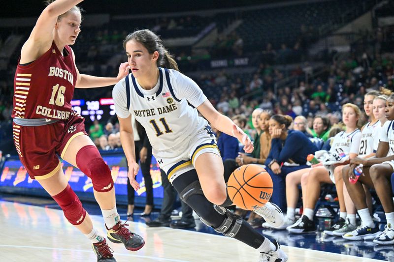 Jan 11, 2024; South Bend, Indiana, USA; Notre Dame Fighting Irish guard Sonia Citron (11) drives to the basket as Boston College Eagles forward Lili Krasovec (16) defends in the second half at the Purcell Pavilion. Mandatory Credit: Matt Cashore-USA TODAY Sports