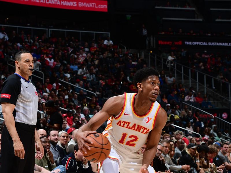 ATLANTA, GA - MARCH 27: De'Andre Hunter #12 of the Atlanta Hawks dribbles the ball during the game against the Portland Trail Blazers on March 27, 2024 at State Farm Arena in Atlanta, Georgia.  NOTE TO USER: User expressly acknowledges and agrees that, by downloading and/or using this Photograph, user is consenting to the terms and conditions of the Getty Images License Agreement. Mandatory Copyright Notice: Copyright 2024 NBAE (Photo by Scott Cunningham/NBAE via Getty Images)