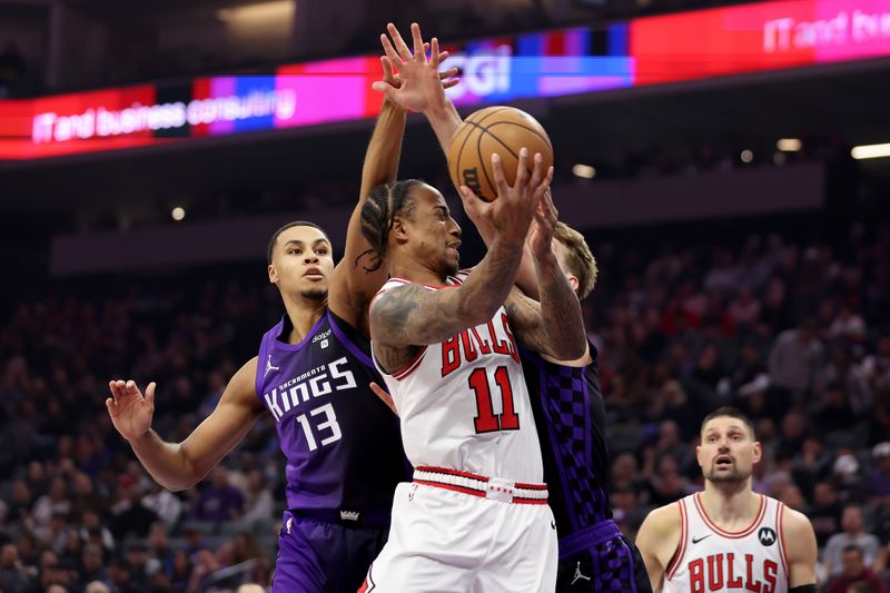 SACRAMENTO, CALIFORNIA - MARCH 04: DeMar DeRozan #11 of the Chicago Bulls goes up for a shot on Keegan Murray #13 and Domantas Sabonis #10 of the Sacramento Kings at Golden 1 Center on March 04, 2024 in Sacramento, California. NOTE TO USER: User expressly acknowledges and agrees that, by downloading and or using this photograph, User is consenting to the terms and conditions of the Getty Images License Agreement.  (Photo by Ezra Shaw/Getty Images)