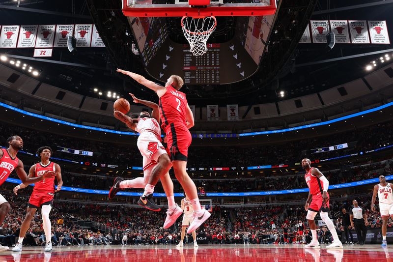 CHICAGO, IL - NOVEMBER 17:   Coby White #0 of the Chicago Bulls shoots the ball during the game against the Houston Rockets during a regular season game on November 17, 2024 at United Center in Chicago, Illinois. NOTE TO USER: User expressly acknowledges and agrees that, by downloading and or using this photograph, User is consenting to the terms and conditions of the Getty Images License Agreement. Mandatory Copyright Notice: Copyright 2024 NBAE (Photo by Jeff Haynes/NBAE via Getty Images)