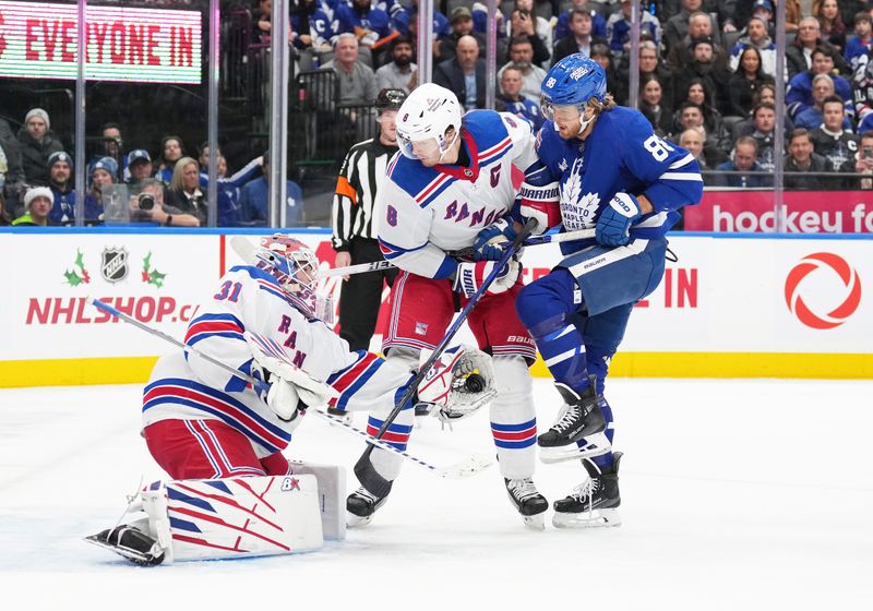 Dec 19, 2023; Toronto, Ontario, CAN; Toronto Maple Leafs right wing William Nylander (88) battles for the puck with New York Rangers defenseman Jacob Trouba (8) in front of goaltender Igor Shesterkin (31) during the first period at Scotiabank Arena. Mandatory Credit: Nick Turchiaro-USA TODAY Sports