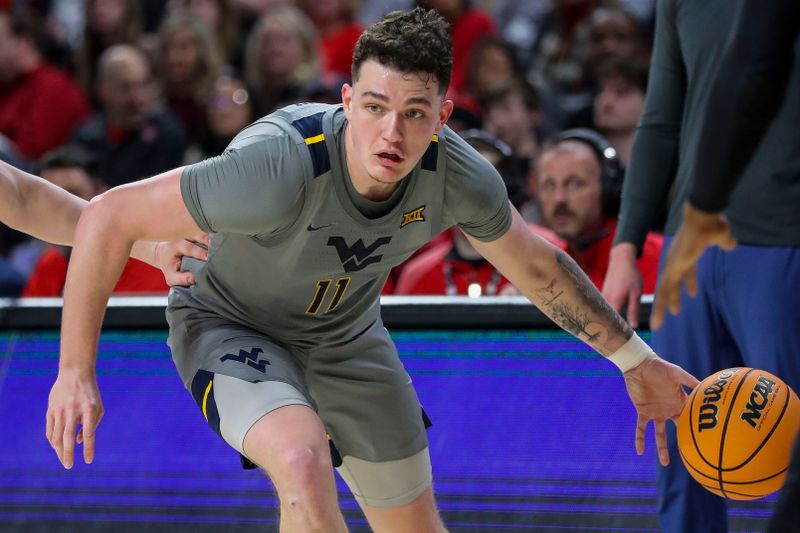 Mar 9, 2024; Cincinnati, Ohio, USA; West Virginia Mountaineers forward Quinn Slazinski (11) dribbles against the Cincinnati Bearcats in the second half at Fifth Third Arena. Mandatory Credit: Katie Stratman-USA TODAY Sports