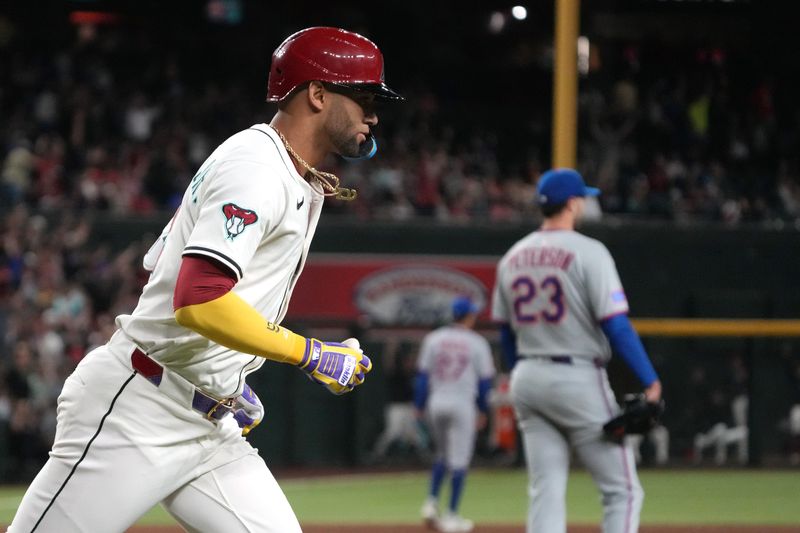 May 6, 2025; Phoenix, Arizona, USA; Arizona Diamondbacks outfielder Lourdes Gurriel Jr. (12) hits a two run home run against the New York Mets in the sixth inning at Chase Field. Mandatory Credit: Rick Scuteri-Imagn Images