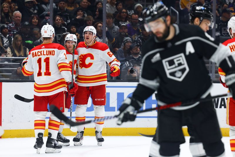 Dec 23, 2023; Los Angeles, California, USA; Calgary Flames center Blake Coleman (20) celebrates with his teammates after scoring a goal against the Los Angeles Kings during the third period of a game at Crypto.com Arena. Mandatory Credit: Jessica Alcheh-USA TODAY Sports