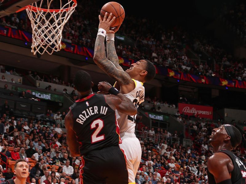 MIAMI, FL - MARCH 2: John Collins #20 of the Utah Jazz drives to the basket during the game against the Miami Heat on March 2, 2024 at Kaseya Center in Miami, Florida. NOTE TO USER: User expressly acknowledges and agrees that, by downloading and or using this Photograph, user is consenting to the terms and conditions of the Getty Images License Agreement. Mandatory Copyright Notice: Copyright 2024 NBAE (Photo by Issac Baldizon/NBAE via Getty Images)