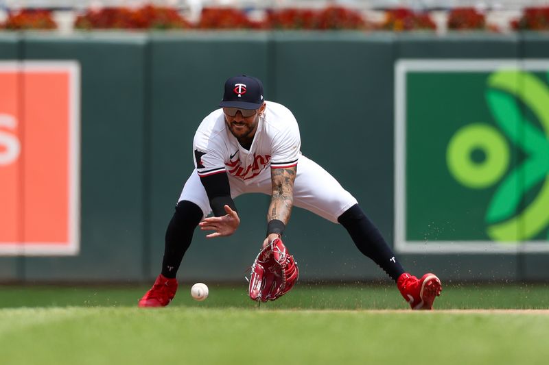 May 16, 2024; Minneapolis, Minnesota, USA; Minnesota Twins shortstop Carlos Correa (4) fields the ball hit by New York Yankees Anthony Volpe (11) during the fifth inning at Target Field. Mandatory Credit: Matt Krohn-USA TODAY Sports