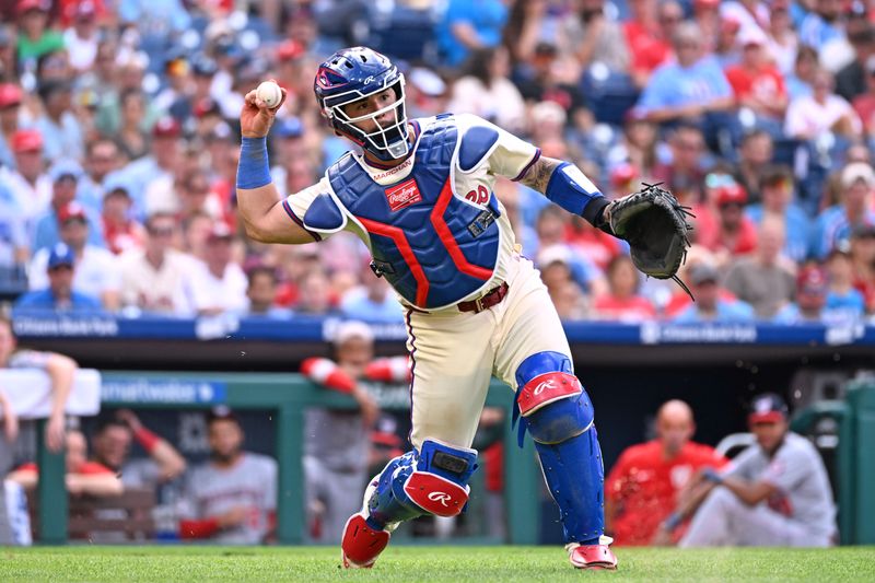 Aug 24, 2025; Philadelphia, Pennsylvania, USA; Philadelphia Phillies catcher Rafael Marchán (13) throws to first base to get an out during the ninth inning against the Washington Nationals at Citizens Bank Park. Mandatory Credit: Eric Hartline-Imagn Images