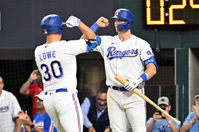 Oct 10, 2023; Arlington, Texas, USA; Texas Rangers first baseman Nathaniel Lowe (30) celebrates with third baseman Josh Jung (6) after hitting a solo home run in the sixth inning against the Baltimore Orioles during game three of the ALDS for the 2023 MLB playoffs at Globe Life Field. Mandatory Credit: Jerome Miron-USA TODAY Sports