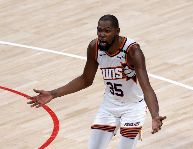 INGLEWOOD, CALIFORNIA - OCTOBER 23: Kevin Durant #35 of the Phoenix Suns reacts for a foul during a 116-113 Suns overtime win over the LA Clippers in the season home opening game at Intuit Dome on October 23, 2024 in Inglewood, California. (Photo by Harry How/Getty Images) NOTE TO USER: User expressly acknowledges and agrees that, by downloading and or using this photograph, User is consenting to the terms and conditions of the Getty Images License Agreement. (Photo by Harry How/Getty Images)