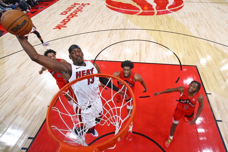 TORONTO, CANADA - JANUARY 17: Bam Adebayo #13 of the Miami Heat drives to the basket during the game against the Toronto Raptors on January 17, 2024 at the Scotiabank Arena in Toronto, Ontario, Canada.  NOTE TO USER: User expressly acknowledges and agrees that, by downloading and or using this Photograph, user is consenting to the terms and conditions of the Getty Images License Agreement.  Mandatory Copyright Notice: Copyright 2024 NBAE (Photo by Vaughn Ridley/NBAE via Getty Images)