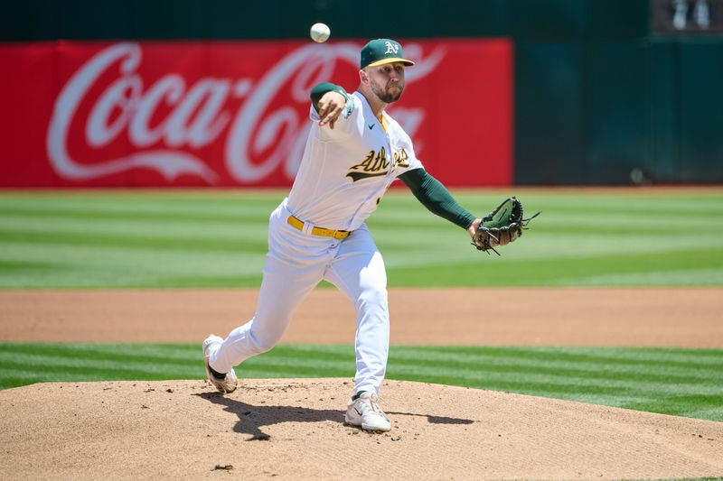 Jun 17, 2023; Oakland, California, USA; Oakland Athletics pitcher James Kaprielian (32) throws a pitch against the Philadelphia Phillies during the first inning at Oakland-Alameda County Coliseum. Mandatory Credit: Robert Edwards-USA TODAY Sports