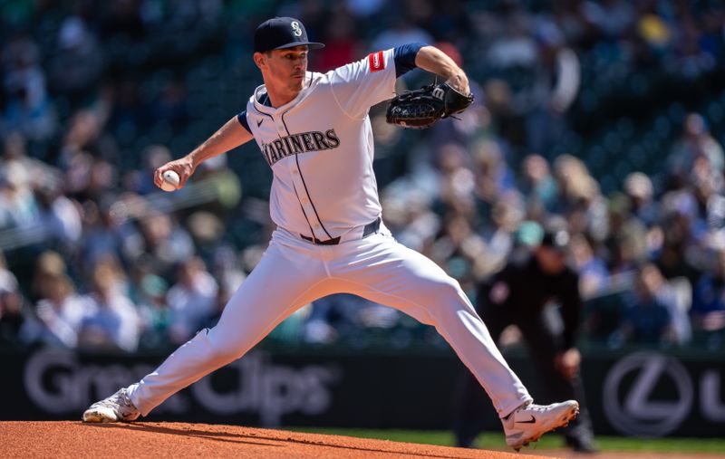 Apr 30, 2025; Seattle, Washington, USA;  Seattle Mariners starter Emerson Hancock (26) delivers a pitch during the first inning against the Los Angeles Angels at T-Mobile Park. Mandatory Credit: Stephen Brashear-Imagn Images