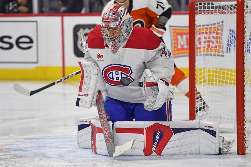 Jan 10, 2024; Philadelphia, Pennsylvania, USA; Montreal Canadiens goaltender Cayden Primeau (30) makes a save against the Philadelphia Flyers during the first period at Wells Fargo Center. Mandatory Credit: Eric Hartline-USA TODAY Sports