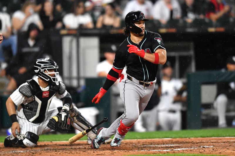 Jun 24, 2025; Chicago, Illinois, USA; Arizona Diamondbacks center fielder Alek Thomas (5) hits an RBI single during the seventh inning against the Chicago White Sox at Rate Field. Mandatory Credit: Patrick Gorski-Imagn Images