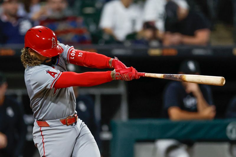 Sep 24, 2024; Chicago, Illinois, USA; Los Angeles Angels shortstop Jack Lopez (10) hits a solo home run against the Chicago White Sox during the eight inning at Guaranteed Rate Field. Mandatory Credit: Kamil Krzaczynski-Imagn Images