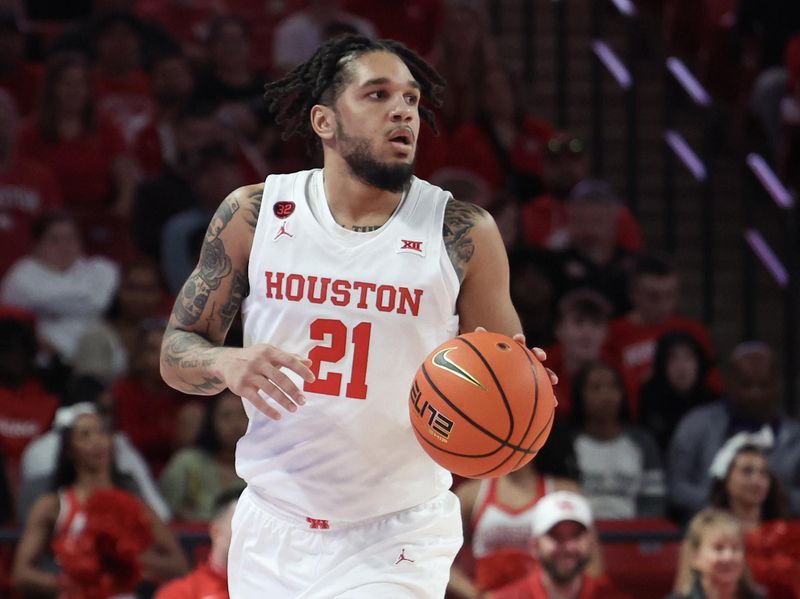 Nov 24, 2023; Houston, Texas, USA; Houston Cougars guard Emanuel Sharp (21) dribbles the ball against the Montana Grizzlies in the first half at Fertitta Center. Mandatory Credit: Thomas Shea-USA TODAY Sports