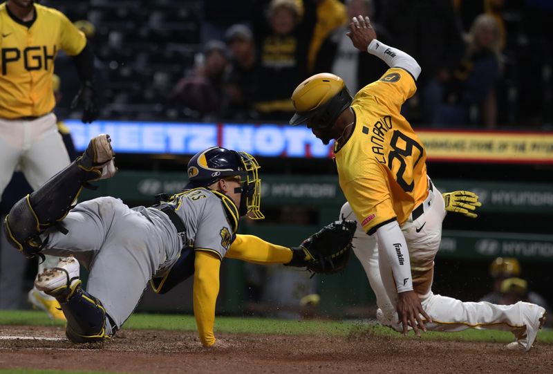 May 23, 2025; Pittsburgh, Pennsylvania, USA;  Pittsburgh Pirates outfielder Alexander Canario (29) slides wide of home plate attempting to score a run as catcher William Contreras (24) attempts a tag during the tenth inning at PNC Park. Canario was ruled out for leaving the baseline. Mandatory Credit: Charles LeClaire-Imagn Images