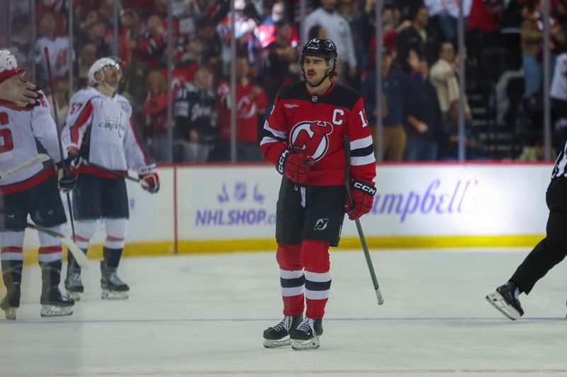 Nov 30, 2024; Newark, New Jersey, USA; New Jersey Devils center Nico Hischier (13) celebrates his goal against the Washington Capitals during the first period at Prudential Center. Mandatory Credit: Thomas Salus-Imagn Images