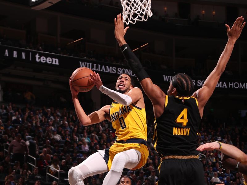 SAN FRANCISCO, CA - MARCH 22: Tyrese Haliburton #0 of the Indiana Pacers drives to the basket during the game against the Golden State Warriors on March 22, 2024 at Chase Center in San Francisco, California. NOTE TO USER: User expressly acknowledges and agrees that, by downloading and or using this photograph, user is consenting to the terms and conditions of Getty Images License Agreement. Mandatory Copyright Notice: Copyright 2024 NBAE (Photo by Jed Jacobsohn/NBAE via Getty Images)