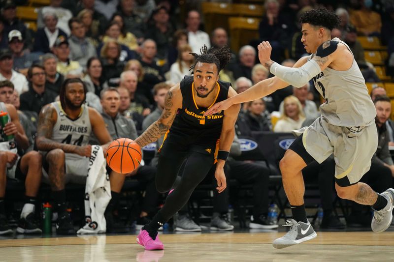 Feb 8, 2024; Boulder, Colorado, USA; Arizona State Sun Devils guard Frankie Collins (1) drives at Colorado Buffaloes guard KJ Simpson (2) in the first half at the CU Events Center. Mandatory Credit: Ron Chenoy-USA TODAY Sports