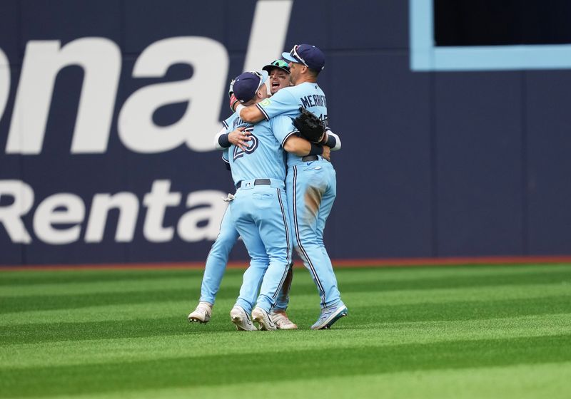 Aug 30, 2023; Toronto, Ontario, CAN; Toronto Blue Jays center fielder Daulton Varsho (25) and right fielder Cavan Biggio (8) and left fielder Whit Merrifield (15) celebrate the win against the Washington Nationals at the end of the ninth inning at Rogers Centre. Mandatory Credit: Nick Turchiaro-USA TODAY Sports