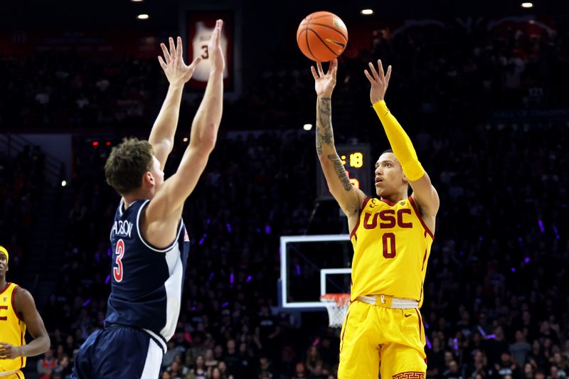 Jan 17, 2024; Tucson, Arizona, USA; USC Trojans guard Kobe Johnson (0) shoots a basket against Arizona Wildcats guard Pelle Larsson (3) during the first half at McKale Center. Mandatory Credit: Zachary BonDurant-USA TODAY Sports